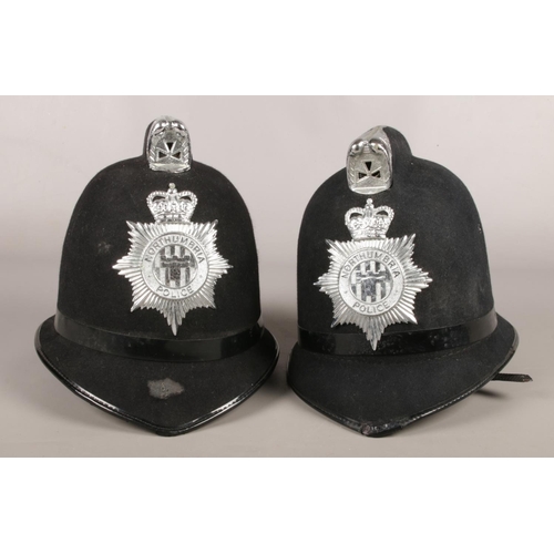 12 - Two Northumbria Police helmets.