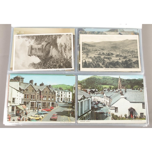 21 - Two folders containing a large collection of vintage postcards from the Lake District and surroundin... 