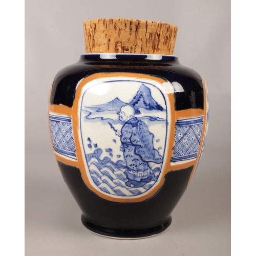 60 - A large Japanese ginger jar with cork stopper. Stamped Japan on the base along with symbol. Jar depi... 