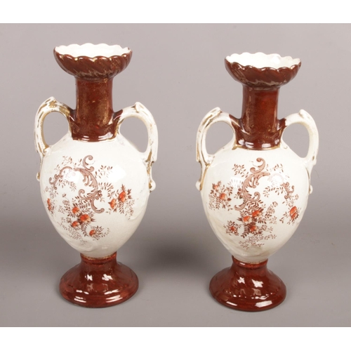 30 - A pair of late Victorian/early Edwardian Crown Derby twin handled urns. Produced by Holmes and Son (... 