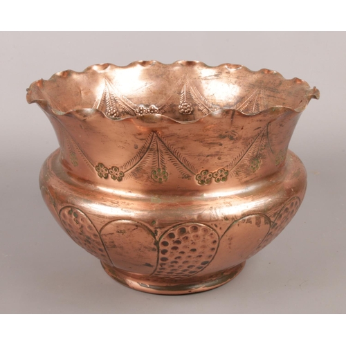 2 - A copper arts & crafts planter with hammered and engraved decoration.