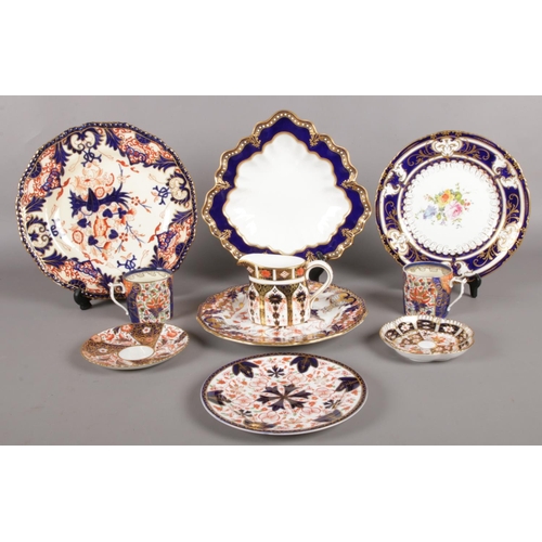 A quantity of Royal Crown Derby ceramics. Mostly in the Imari pattern. Including leaf shaped dish with blue border, jug, trinket dish, cabinet plates, etc.