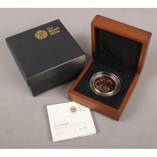 A Royal Mint £5 Brilliant Uncirculated Gold Coin, 2011. No. 235/1000. 39.82g.