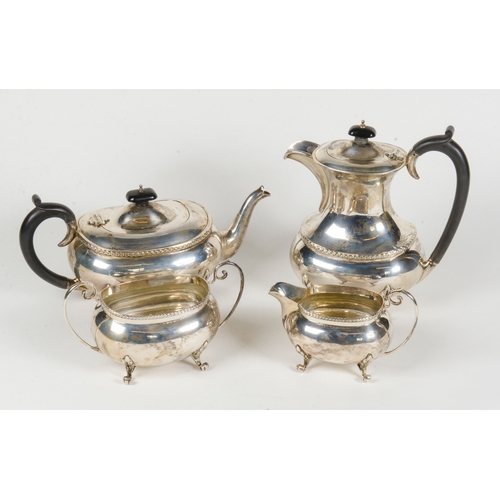 15 - A silver 4 piece tea and coffee set, decorated with a Chippendale boarder and resting on pad feet.
1... 