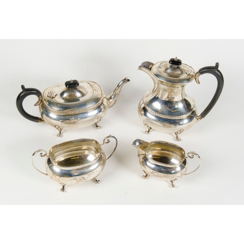 15 - A silver 4 piece tea and coffee set, decorated with a Chippendale boarder and resting on pad feet.
1... 