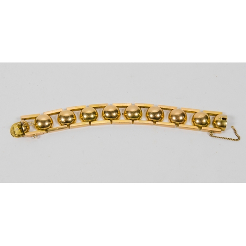 99 - An 18 Carat Gold Ball and Bar Bracelet, modernist design, marked 18K, possibly after a design to Nau... 
