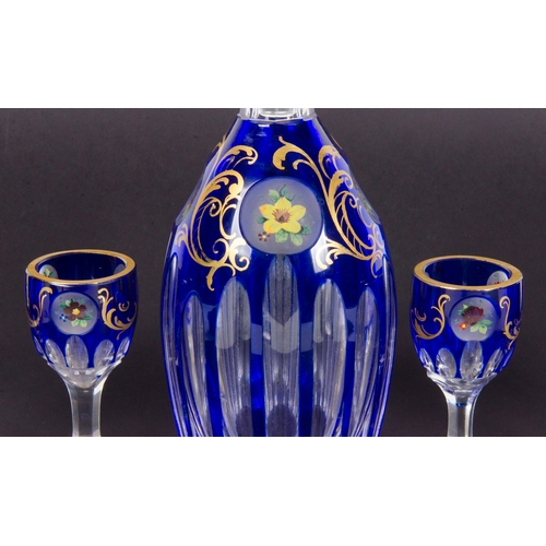 291 - A set of 6 Bohemia blue wine glasses, flash and gilt, with a matching decanter.