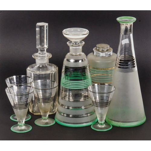 292 - An Art Deco collection of a Cut Glass Decanter, Cocktail Shaker, Glasses, etc.