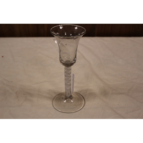 296 - An Antique Georgian wine glass, trumpet shaped, cotton twist and resting on a splayed out foot.