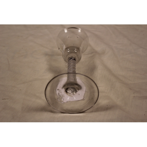 296 - An Antique Georgian wine glass, trumpet shaped, cotton twist and resting on a splayed out foot.