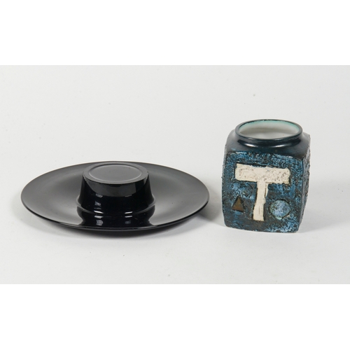 316 - A Troika blue glazed slab vase, along with a black glass posy vase.
 7.5 inches wide.