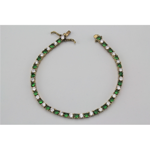 101 - A green stone and paste mounted bracelet.