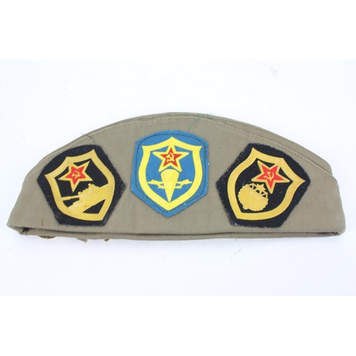 268 - A Russian design badge mounted hat.