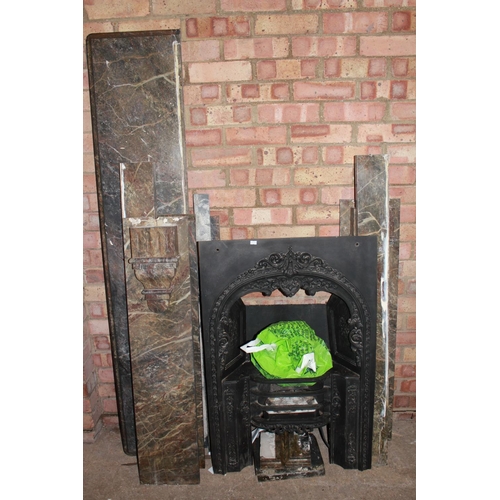108 - A Victorian Brescia marble fire place with shaped sides and iron fittings.