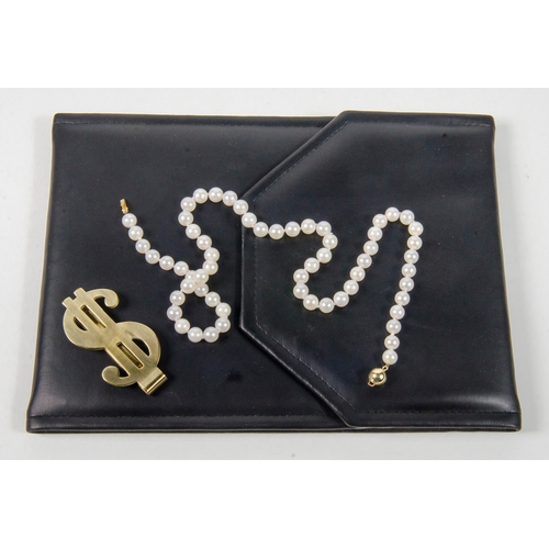 19 - A ladies Pearl Necklace Gold coloured clasp in original black case with a money clip.