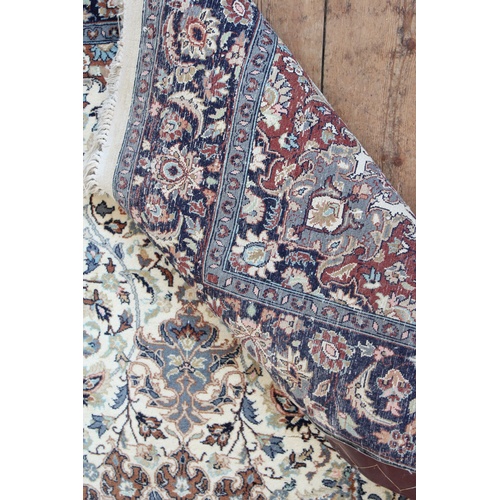 244 - An All Over cream & blue Floral Bordered Central medallion Carpet with central floral design. Measur... 