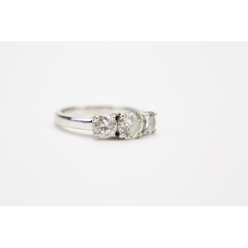 92 - A Beautiful Ladies (750) White Gold Wedding Ring set with Three stunning Diamonds. Total Weight: 7.6... 