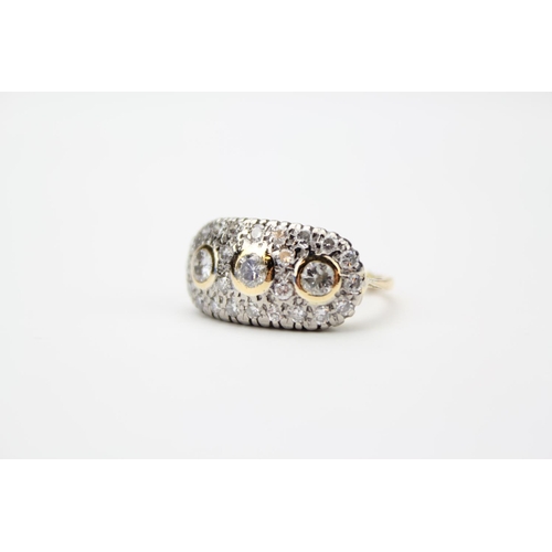 47 - A Ladies Gold Set Diamond Cluster Ring Mounted with Three Central Diamonds and surrounded by Small C... 