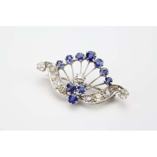 48 - A Ladies Diamond Set Spray Brooch Decorated with a Cluster of Sapphires over a Swag of Diamonds.