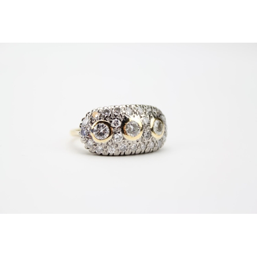 110 - A Ladies Gold Set Diamond Cluster Ring Mounted with Three Central Diamonds and surrounded by Small C... 