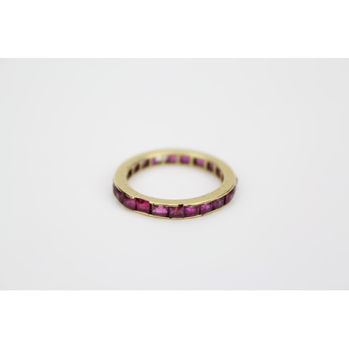 114 - A Ladies Gold Ring set with a line of Ruby's. Size: k.
