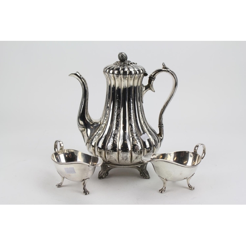 28 - A Victorian EPBM Silver Plated coffee pot with engraved decoration and two Sauce boats.