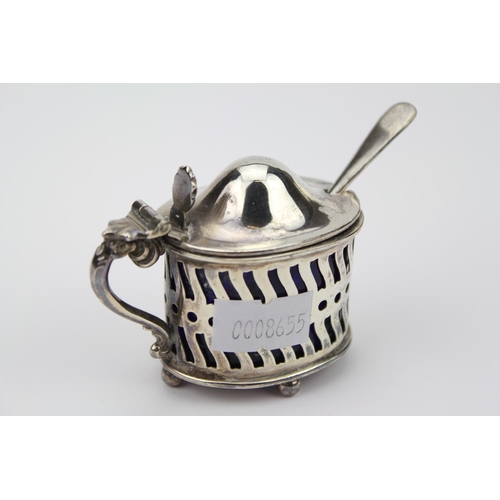 15 - A Pierced Silver Mustard with Scroll Handle along with Spoon & Liner.