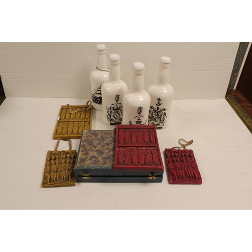 435 - Four PortMerion black and white decanters along with some wax medieval plaques, etc.