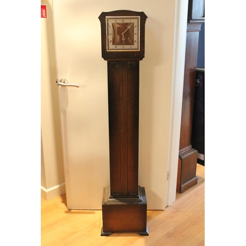 199 - A Oak Cased Grand Mother Clock with a Brass & Nickel Face with Key.