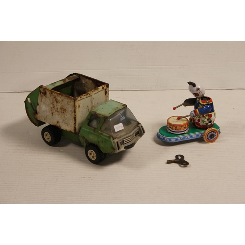 2 - An Original Tonka Toys Dump Truck in Poor Condition along with a Clockwork Chinese Cat playing the d... 
