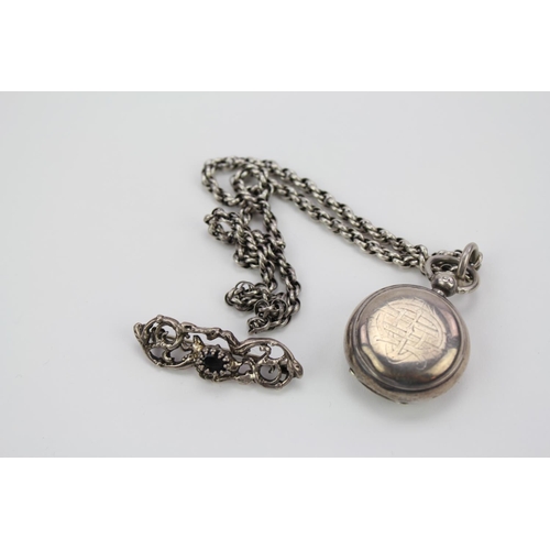 56 - A Silver Sovereign Case on chain along with a Victorian brooch.