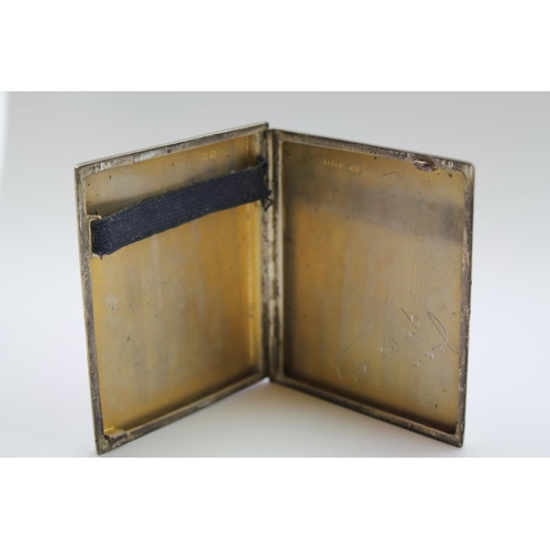 13 - A Silver Engine Turned Sliding action cigarette case, 1937. Weight approx 108 grams.