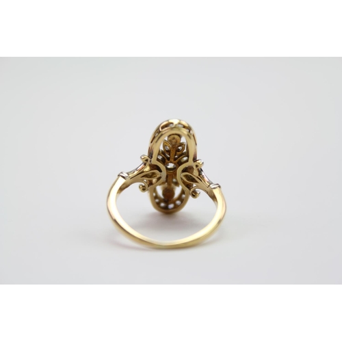 105 - A Ladies Pearl and Diamond set Dress Ring with old cut Diamonds. Size J.