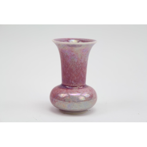 307 - A Ruskin of West Smethwick pink glazed specimen vase, marked Ruskin 1925. 7cm.