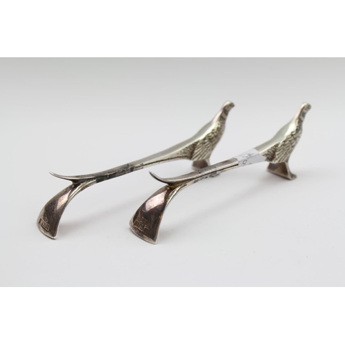 16 - A pair of silver pheasant knives rests Birmingham r modern 64 grams
