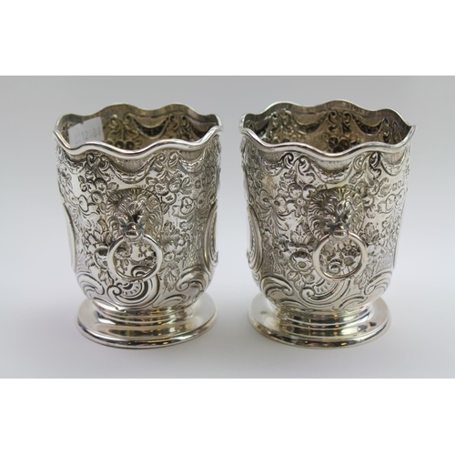 17 - A pair of silver miniature lion handled wine coolers with embossed decoration, Gold smiths and silve... 