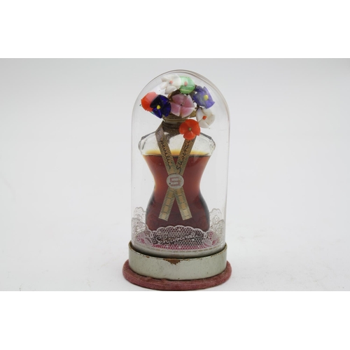 95 - Vintage Schiaparelli perfume under glass dome.