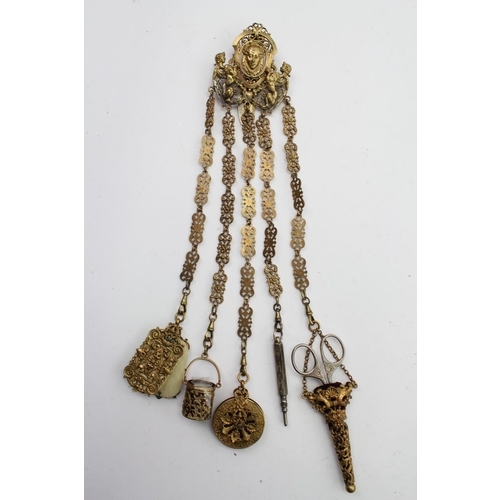 69 - A chatelaine hung with note pad, thimble, pencil, pin holder, and scissors made for the Nuns in case... 
