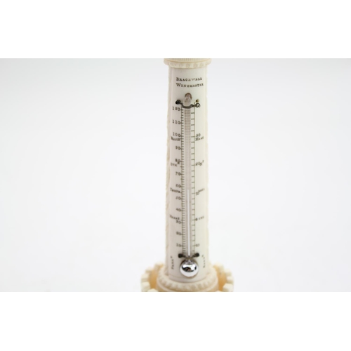 53 - Holzapfel turned based stand, with an Indian export ivory thermometer, retailed through Bracewell’s ... 