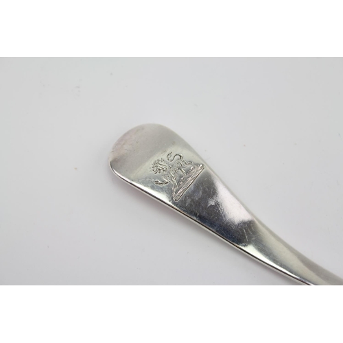 32 - A Silver sifting spoon, rat tail with a family crest.
