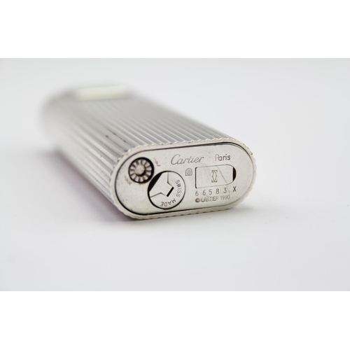 88 - A Cartier fluted ribbed lighter, model number 66583X, copyright 1990.