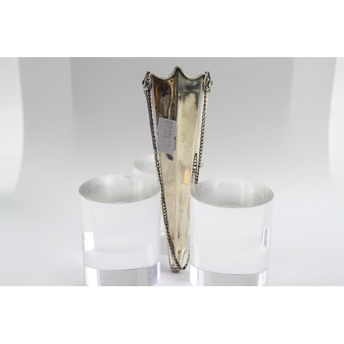 58 - A Victorian Silver fluted posey holder, with chain attachment.