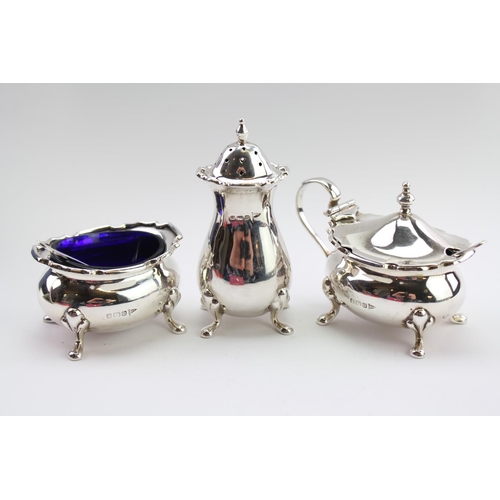 12 - A Three Piece Silver Cruet Set with Blue Liners. Weighing: 149 grams.