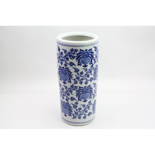 315 - A Blue & White Cylindrical Umbrella Stand decorated with Lotus Leaves & Flowers.