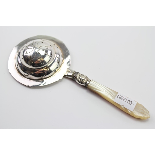 15 - A Silver Marked Tea Strainer, mounted with a mother of pearl handle, marked TB & S.