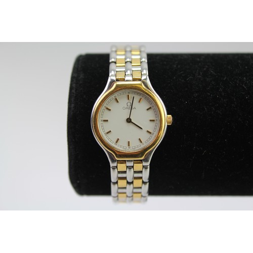 128 - A ladies Omega bi-metal wrist watch, with extendable clasp and white face.