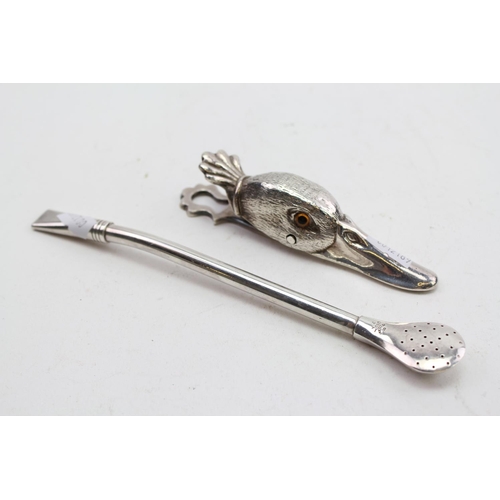 42 - A Silver Plated Ducks Head Paper Clip and a Mate Pot Spoon.