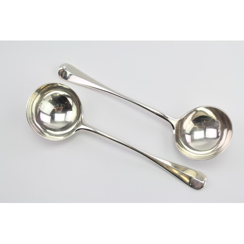 32 - A Pair of Silver Old English Rat Tail sauce ladles by George Adams, London E, with family crest.