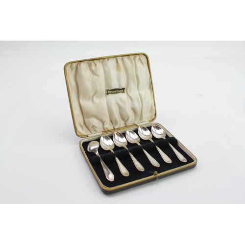 35 - A set of 6 Silver thread edge tea spoons in case, marked EV.