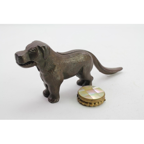 458 - A Dog Nut Cracker along with a mother of pearl pill box.